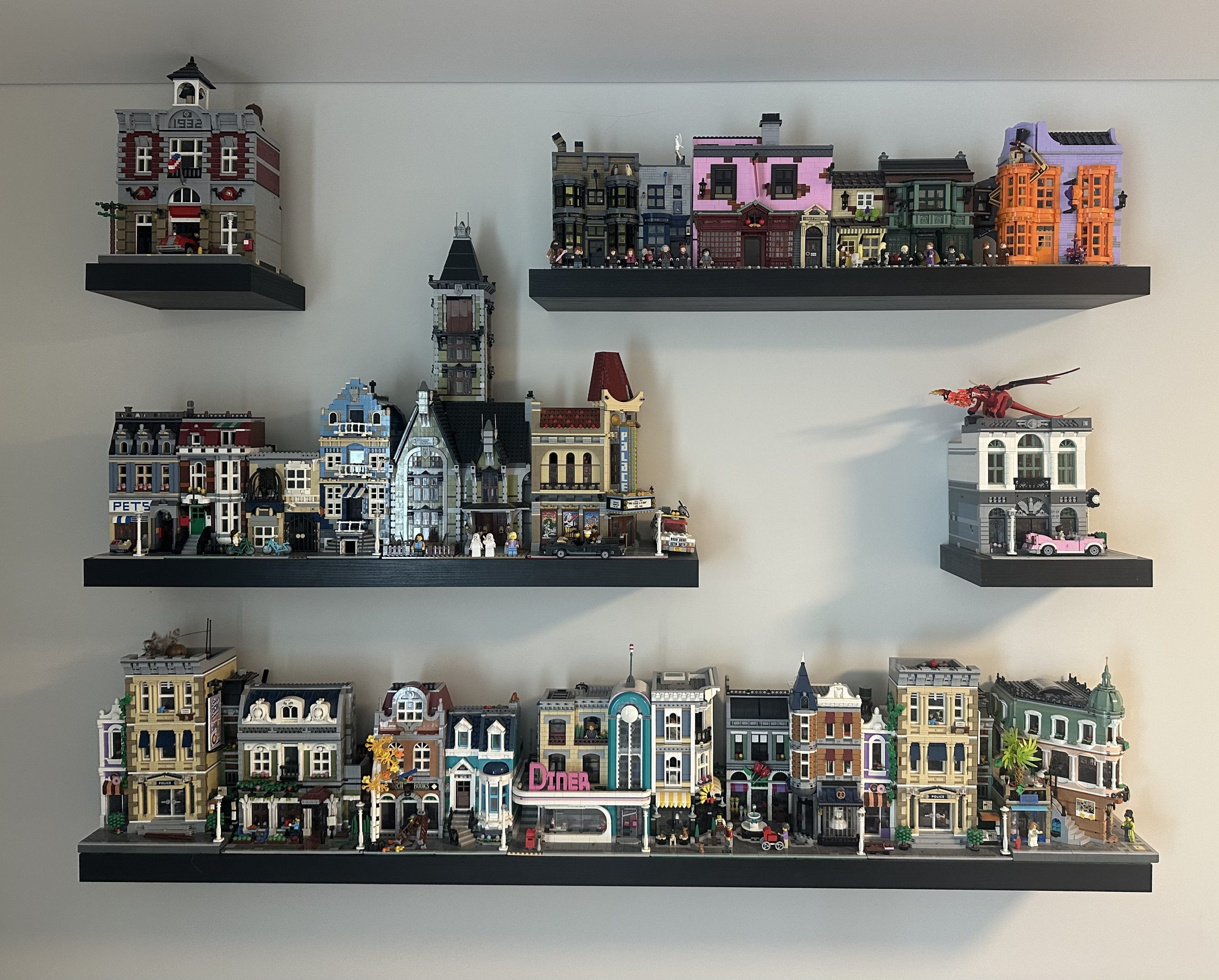 InfinityOfTiles home LEGO collection displayed on wall shelves